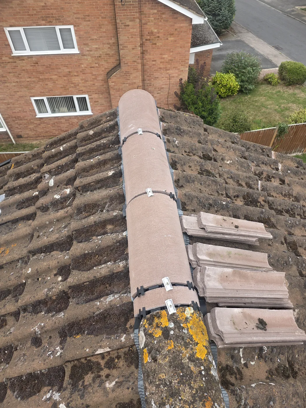 Previous ridge installation found before remedial work. Cole Roofing removed the incorrectly installed ridge work and then installed a new ridge line throughout.