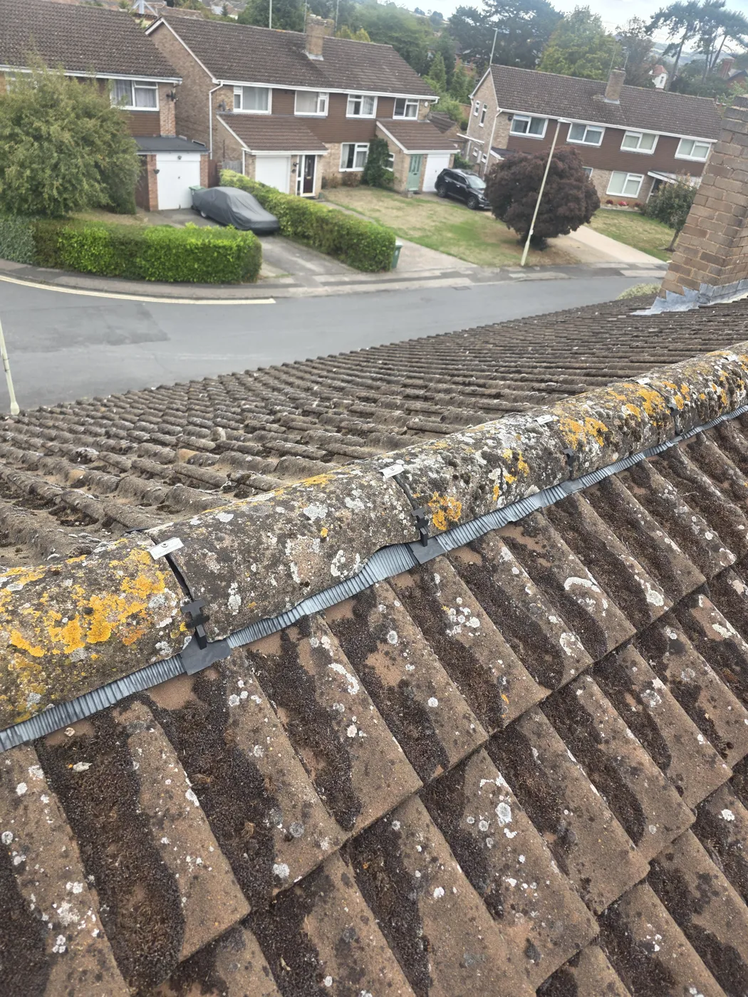 Existing ridge tiles before replacement.